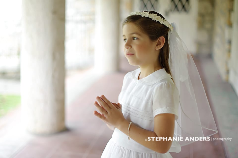 girl in white dress praying