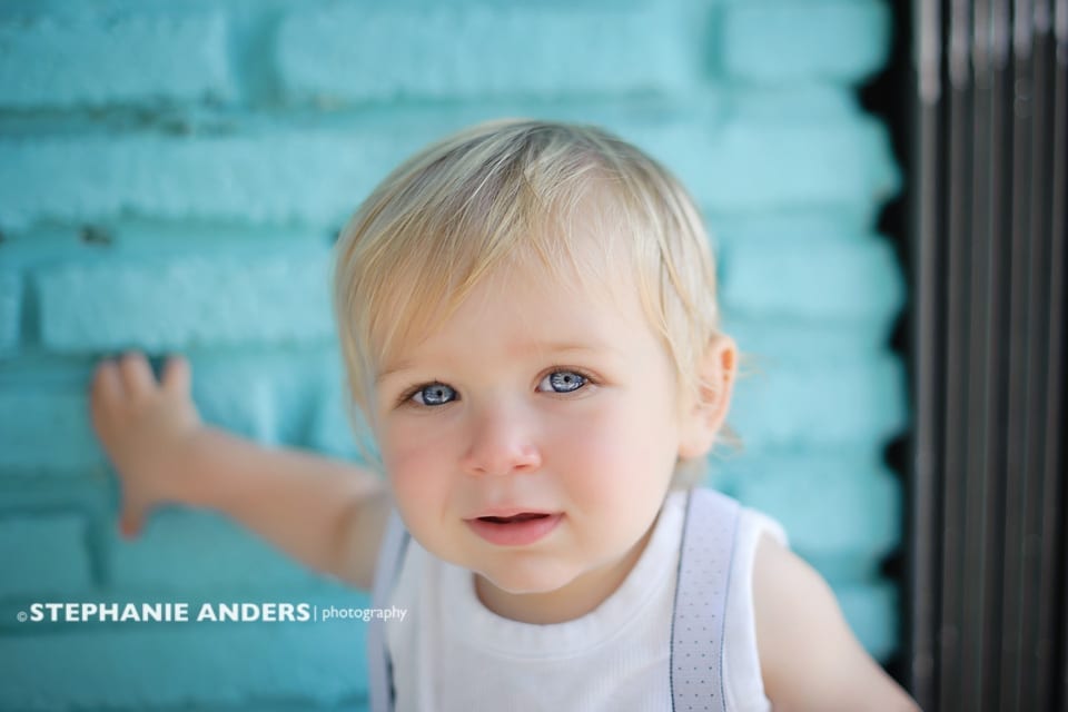 baby boy with blue eyes and blue background
