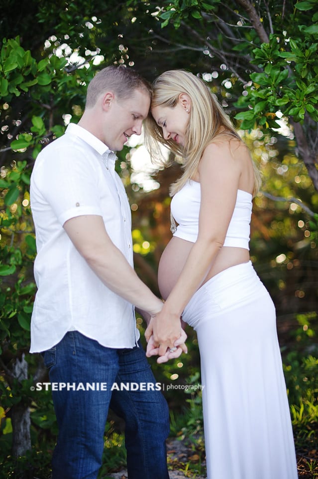 husband and pregnant wife during photoshoot