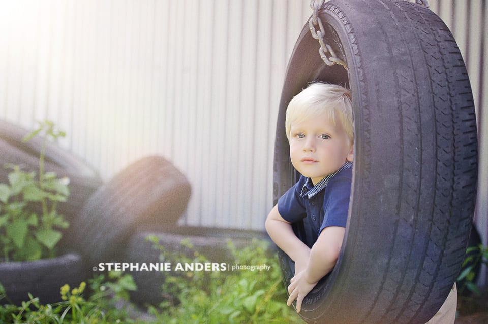 blonde boy in swing tire on location at Rustic Fields in Florida