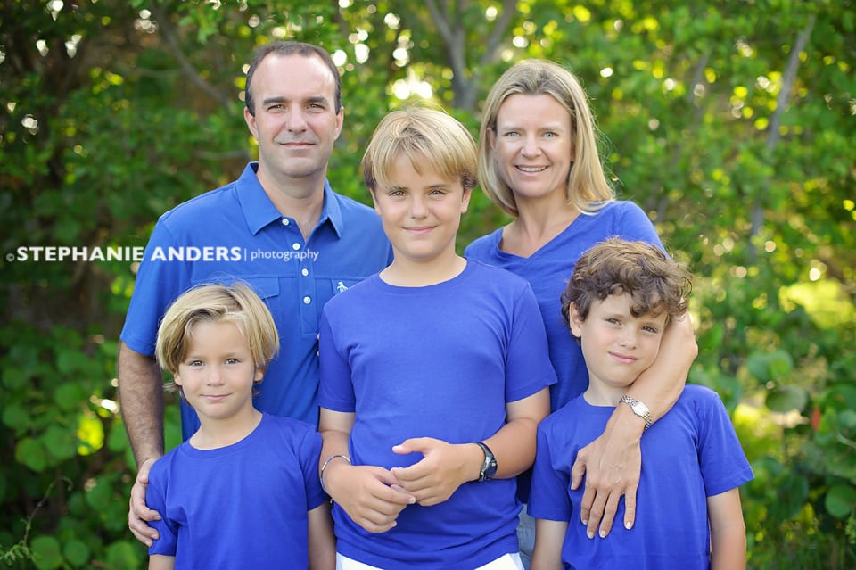 family in matching blue shirts