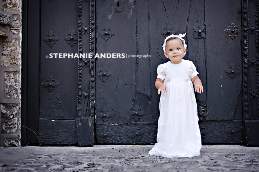 small girl in white dress before baptism