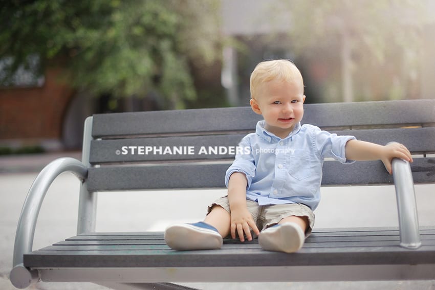 baby boy sitting on bench