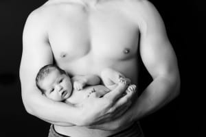 newborn in daddys arms