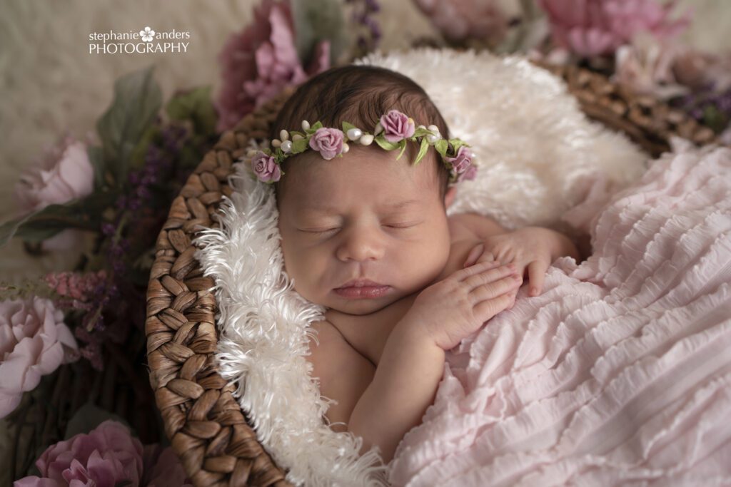 Newborn girl with flowers